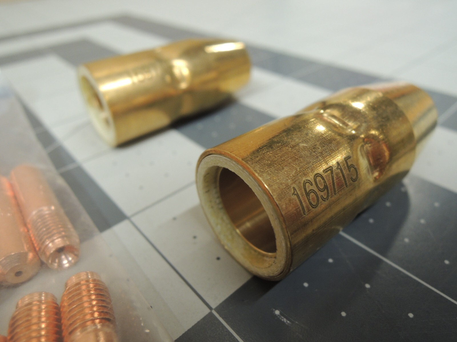 Miller 000068 Contact Tips (20), 169715 Nozzles (2), and Mig Adapters (2)