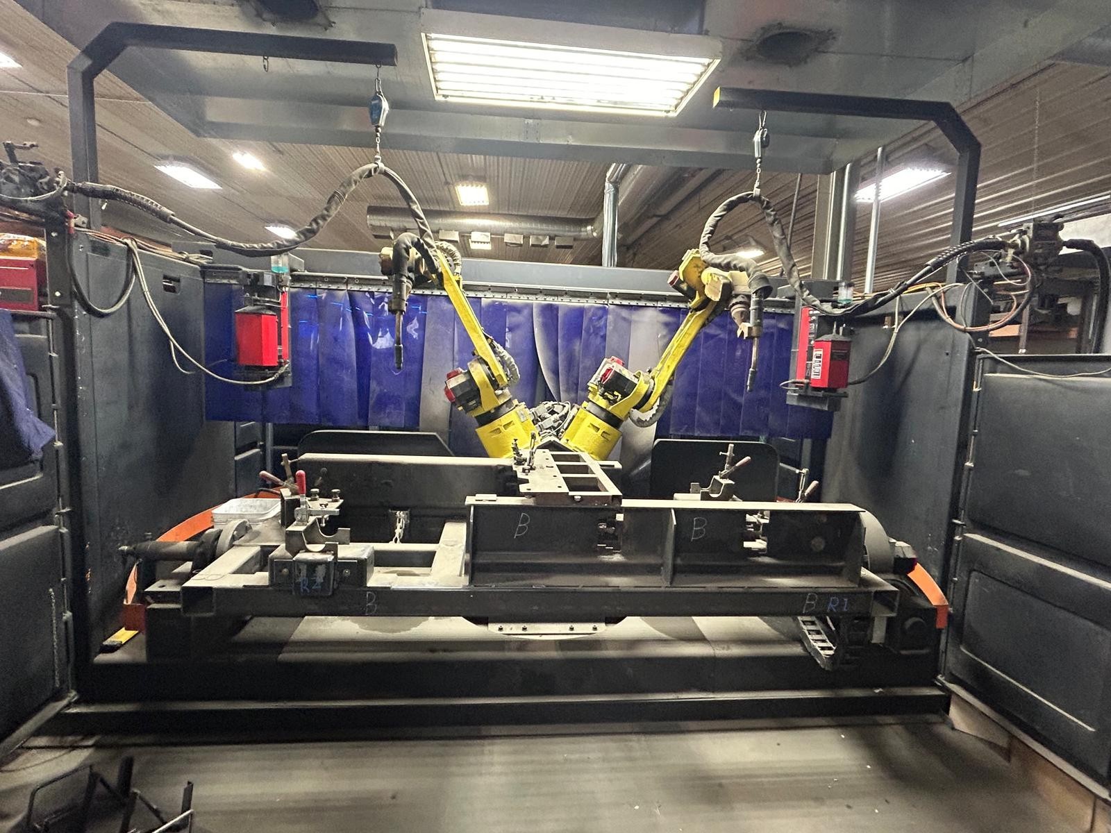 Lincoln Powered Robotic Welding Cell with Fanuc Robots by IPG Genesis Automation